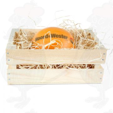 Edam cheese in a wooden crate